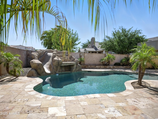 2822 E Constance Way, Phoenix, AZ 85042 - view of swimming pool featuring a fenced backyard and a water slide