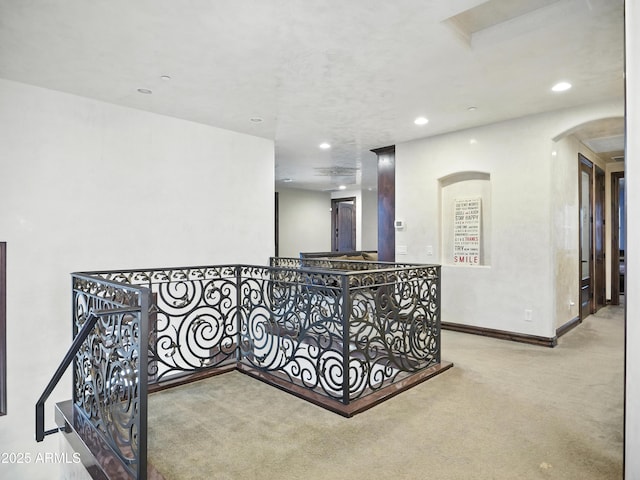 2822 E Constance Way, Phoenix, AZ 85042 - hallway with an upstairs landing, carpet floors, arched walkways, and recessed lighting