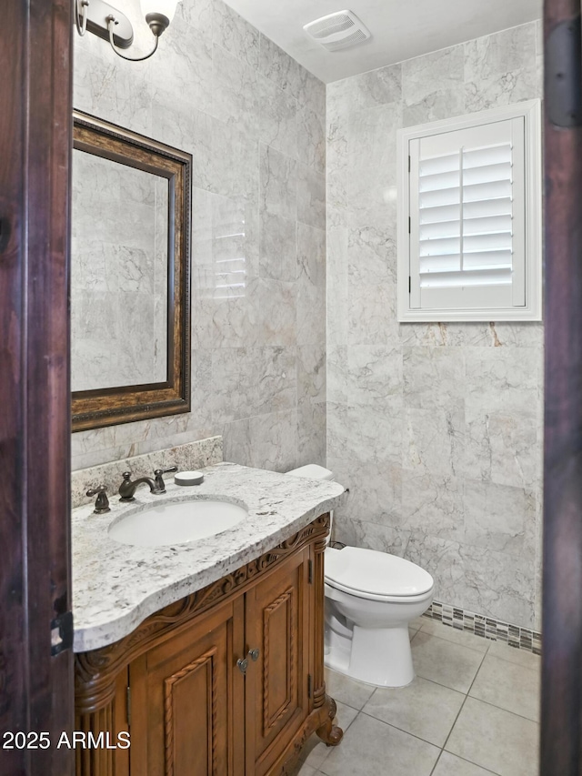 2822 E Constance Way, Phoenix, AZ 85042 - half bath with vanity, tile patterned flooring, and tile walls