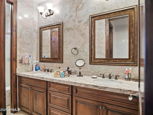 2822 E Constance Way, Phoenix, AZ 85042 - bathroom with double vanity and tile walls