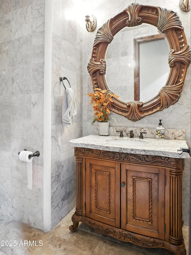 2822 E Constance Way, Phoenix, AZ 85042 - bathroom featuring vanity and tile walls