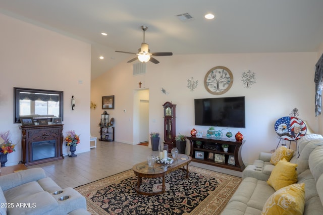 living room with recessed lighting, visible vents, ceiling fan, and light wood finished floors