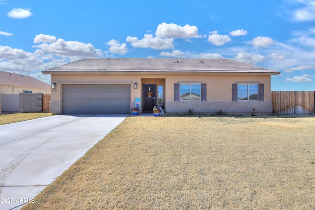 ranch-style home featuring concrete driveway, fence, an attached garage, and stucco siding