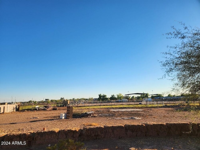 view of yard with a rural view