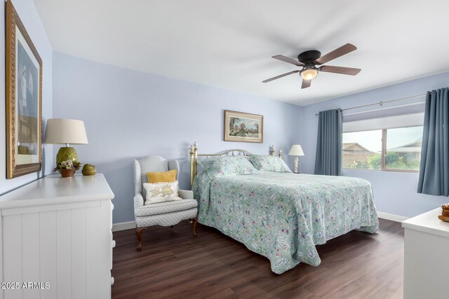 bedroom featuring ceiling fan and dark hardwood / wood-style floors