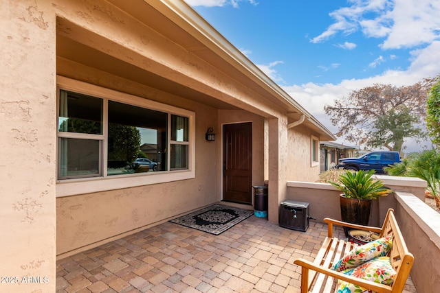 property entrance with a patio