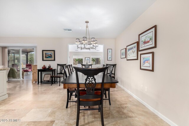 dining area featuring a chandelier