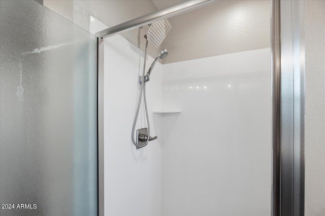 room details featuring a shower with shower door