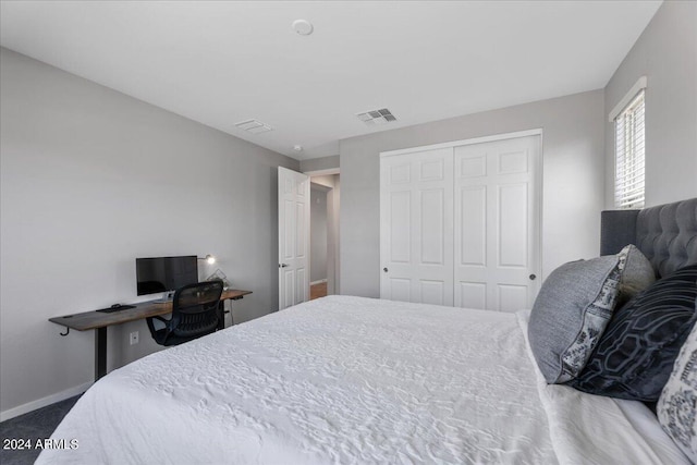 carpeted bedroom with a closet