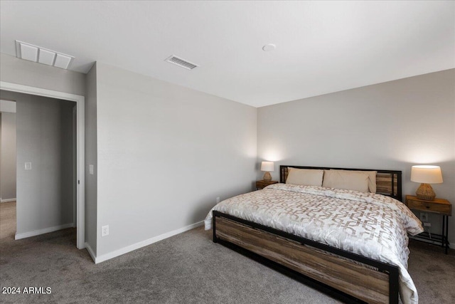 bedroom with dark carpet