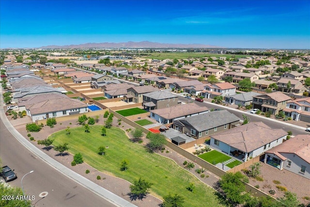 birds eye view of property with a mountain view