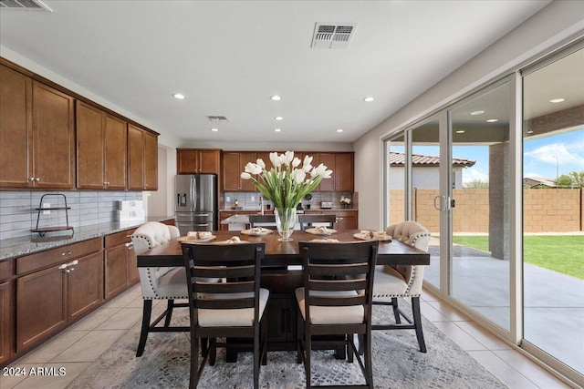 dining room with light tile patterned flooring