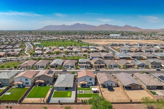 birds eye view of property featuring a mountain view