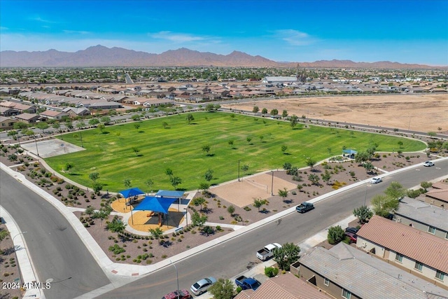 birds eye view of property with a mountain view