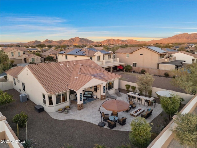 birds eye view of property with a residential view and a mountain view