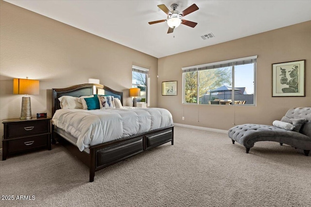 bedroom with carpet floors, visible vents, ceiling fan, and baseboards