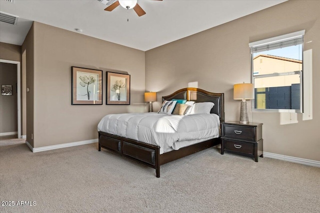 carpeted bedroom with visible vents, ceiling fan, and baseboards