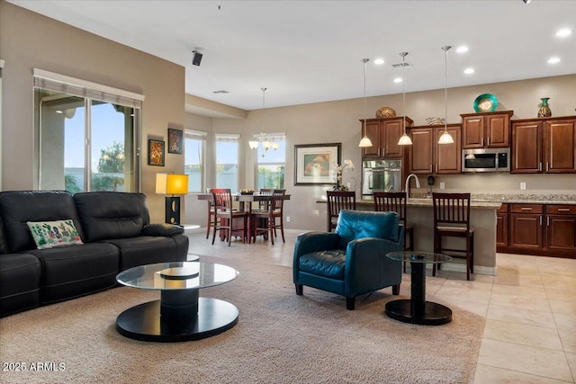 living room featuring light tile patterned floors, a chandelier, recessed lighting, visible vents, and baseboards