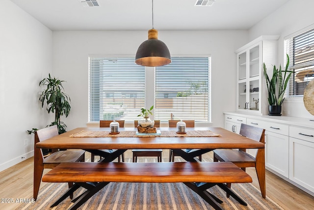 dining space with light wood-style floors