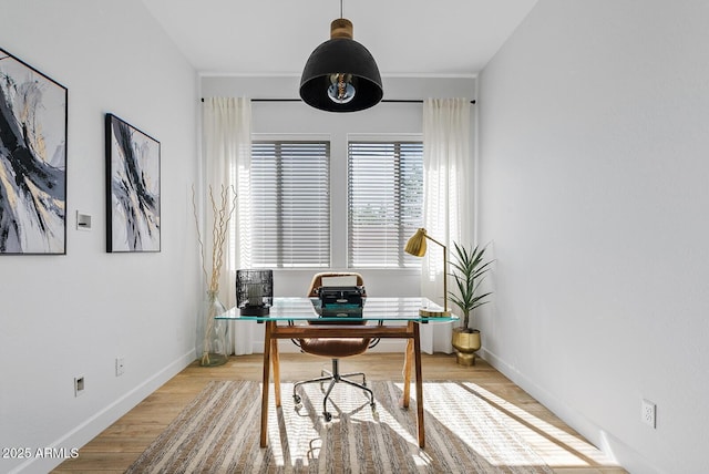 office space with light wood finished floors and baseboards