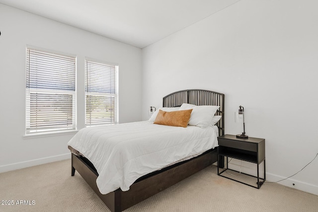 bedroom with carpet and baseboards