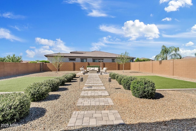 fenced backyard featuring a patio