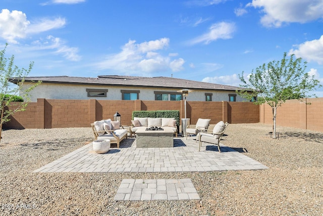rear view of property featuring an outdoor living space with a fire pit, stucco siding, a patio area, and a fenced backyard