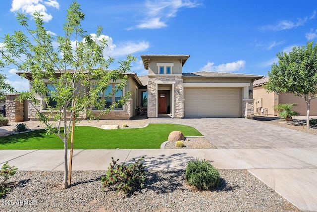 view of front facade with stucco siding, stone siding, a garage, driveway, and a front lawn