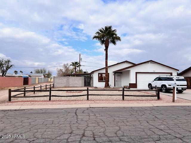 ranch-style home with a garage