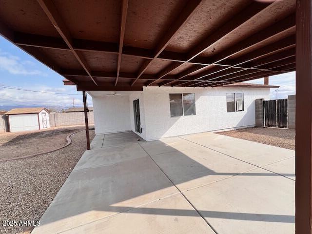 view of patio / terrace featuring a storage unit