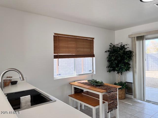 tiled dining area with sink