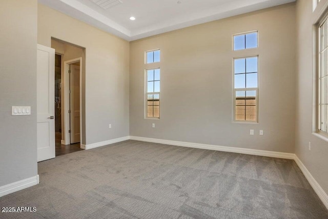 carpeted empty room with visible vents, recessed lighting, and baseboards