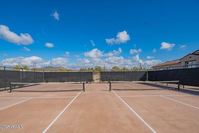 view of sport court with fence