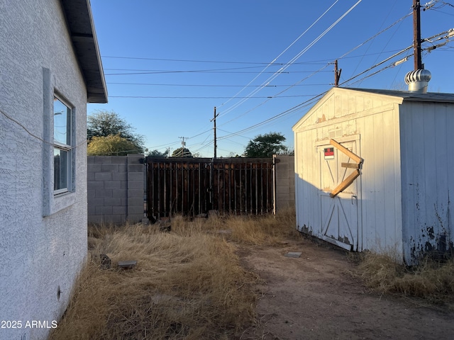 exterior space with a shed