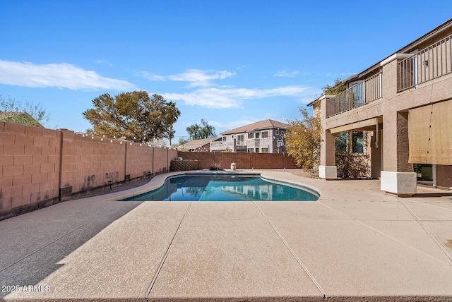 view of swimming pool featuring a fenced in pool, a patio area, and a fenced backyard