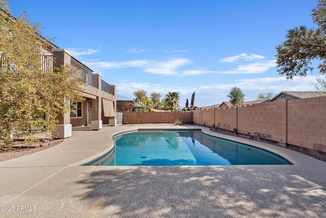 view of swimming pool featuring a patio, a fenced backyard, and a fenced in pool