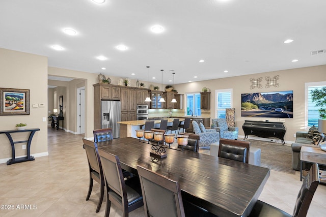 tiled dining room with sink