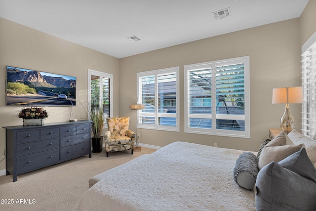 bedroom with light carpet