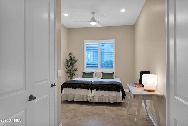 tiled bedroom featuring ceiling fan