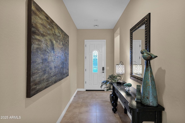 foyer entrance featuring light tile patterned floors