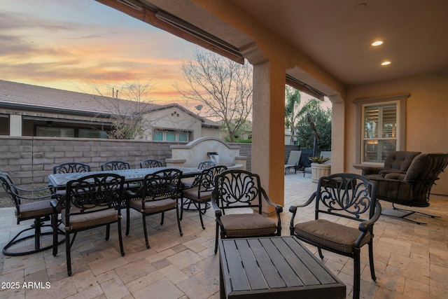 patio terrace at dusk with an outdoor living space