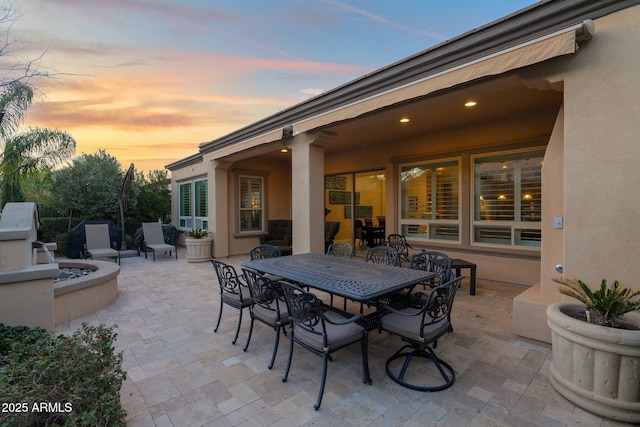 view of patio terrace at dusk