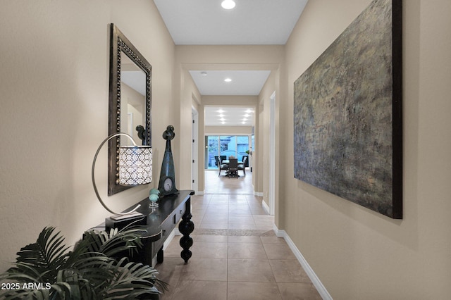 corridor with light tile patterned floors