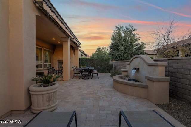 view of patio terrace at dusk