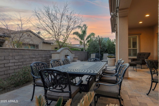 view of patio terrace at dusk