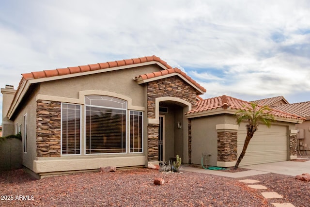 mediterranean / spanish house featuring a tile roof, stone siding, stucco siding, and a garage