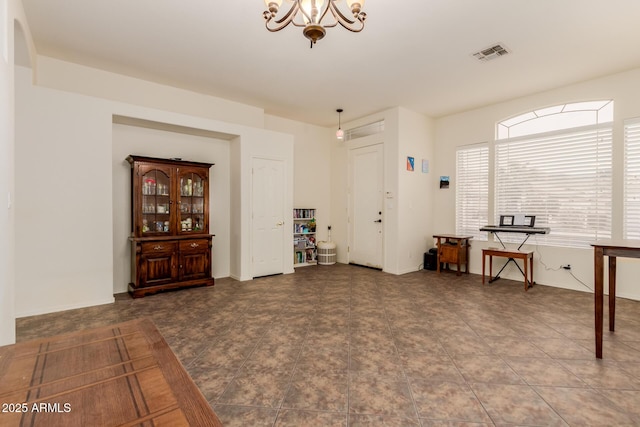 interior space featuring an inviting chandelier and visible vents