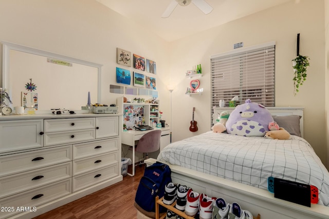bedroom with a ceiling fan and wood finished floors