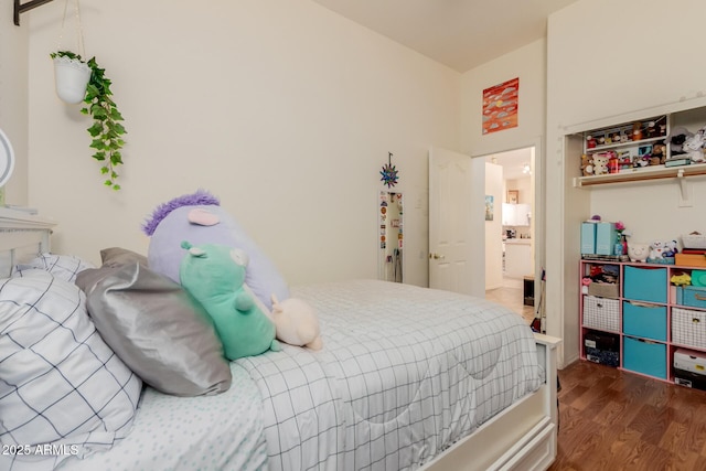 bedroom with wood finished floors
