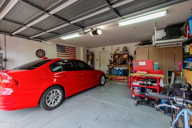 garage with a garage door opener and electric water heater